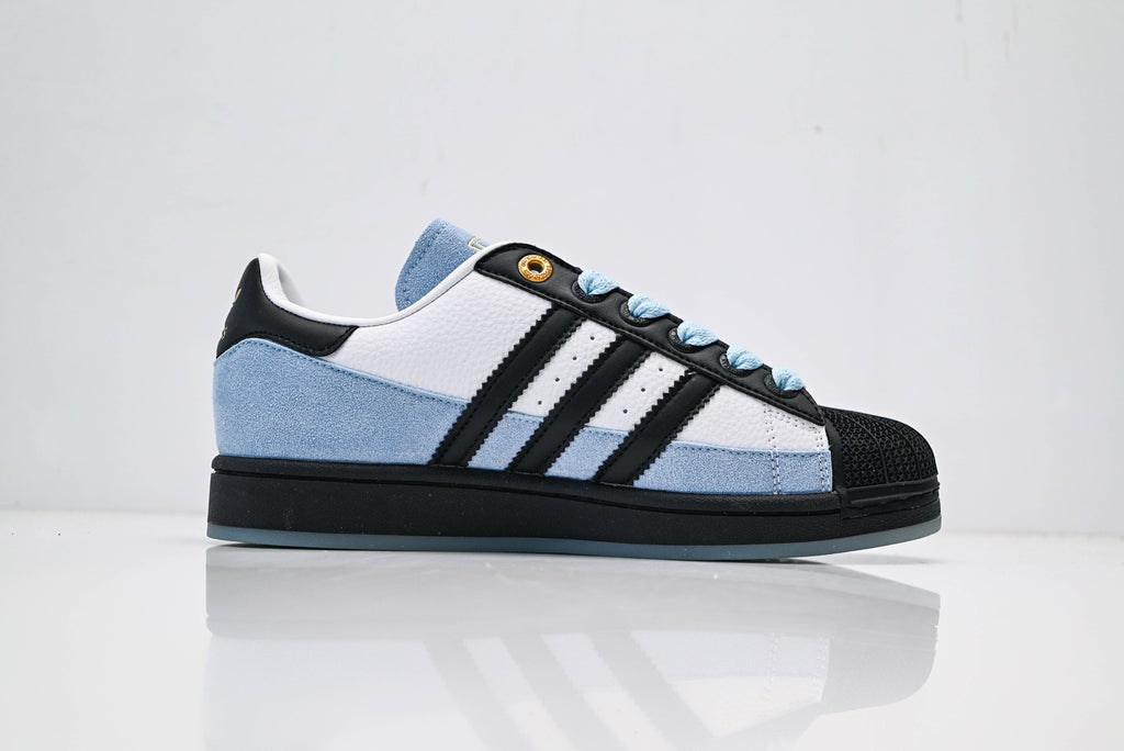 adidas Originals Superstar – Light Blue Upper with White 3-Stripes, Black Heel Tab & Gold Accents