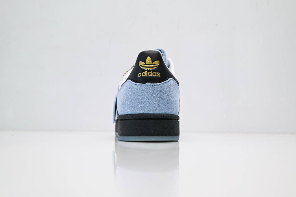 adidas Originals Superstar – Light Blue Upper with White 3-Stripes, Black Heel Tab & Gold Accents